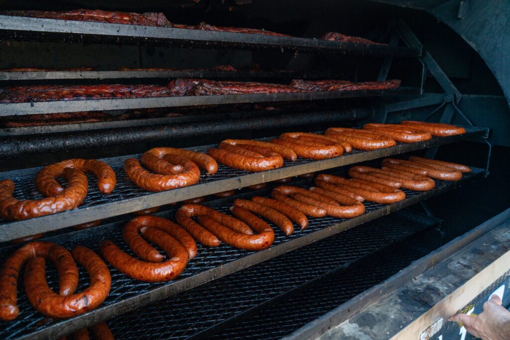 Sausages on the smoker racks